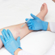 Doctor performs sclerotherapy for varicose veins on the legs